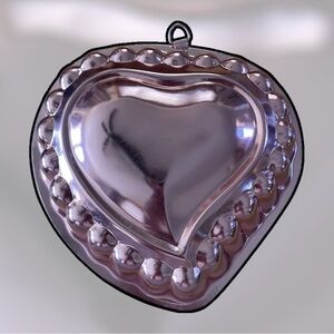 Nevco pink colored heart mold, suitable for use or display, aluminum, I believe